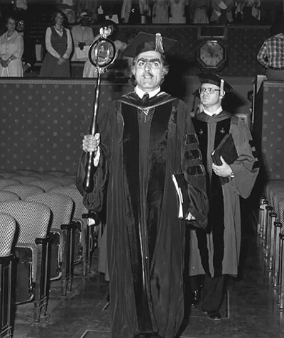 Professor Said carrying the ceremonial mace in the 1978 graduation procession. Traditionally the mace is carried by an academic with the highest rank by honor and standing. (Courtesy of American University.)